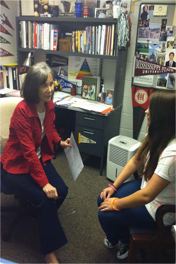 Mrs. Roberts discuses college options with a student.