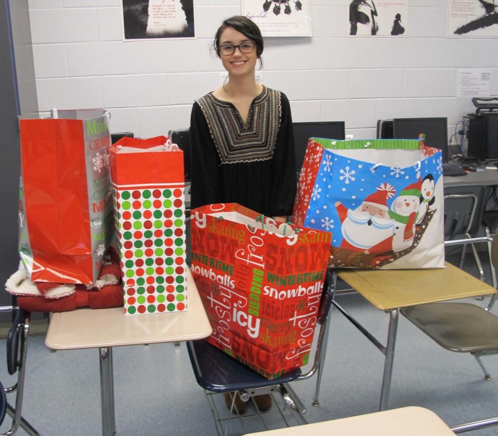 Sadie Turner, an FBLA member, shows off the presents for the seniors.
