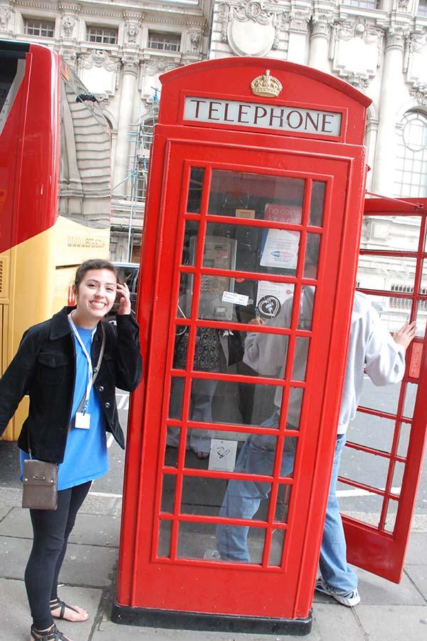 Adrienne Dauma poses by a phone booth during the previous London trip