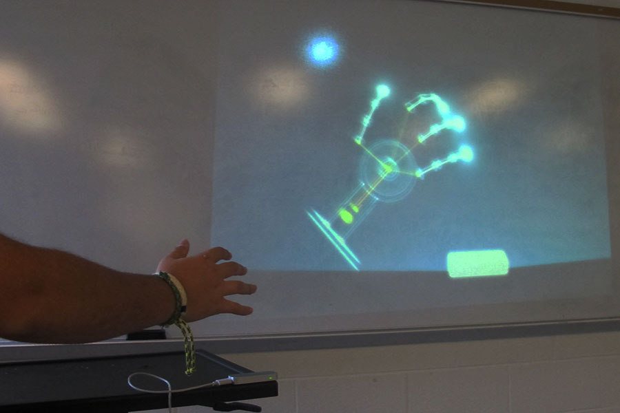 Student explores a robotic arm rendering using the Leap Motion Controller. 
