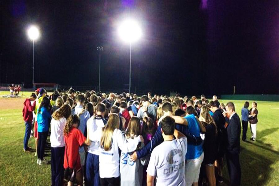 All of the students gathered on the baseball field