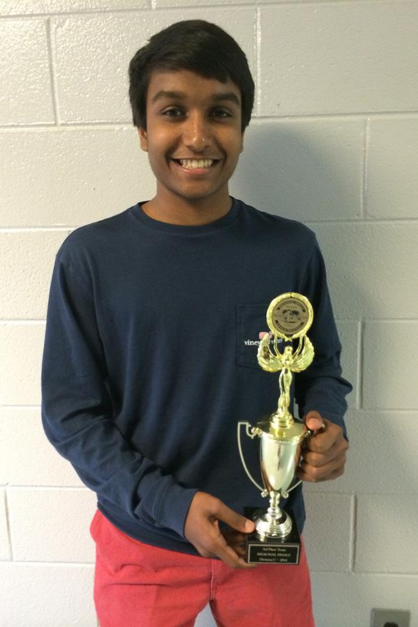 Siddhu Srikakolapu, a junior at Bob Jones, holds the teams third place regional trophy.