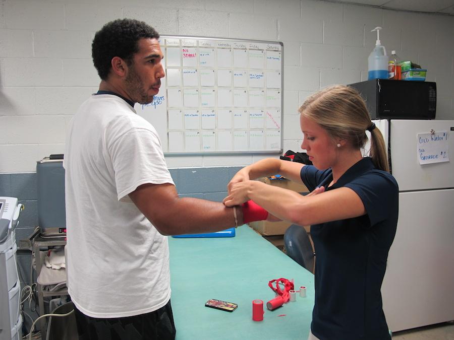 Medical Academy Interns Learn on the Sidelines