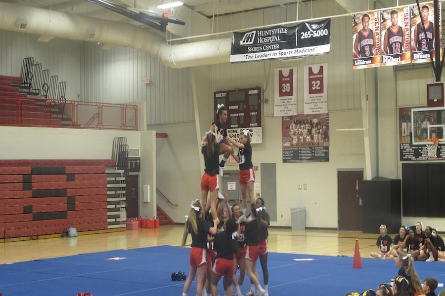 Varsity+cheerleaders+perform+their+competition+routine+at+Sparkman+High+School+on+Sunday%2C+February+1st.+