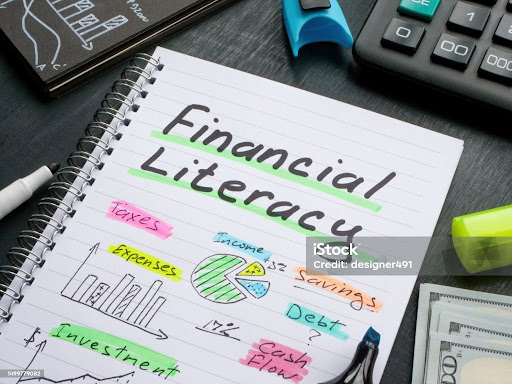 Notebook with marks about financial literacy.
